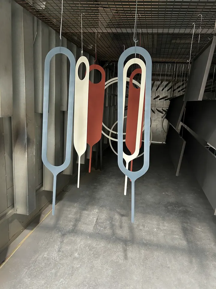 Sculptural loops in blue, white and red